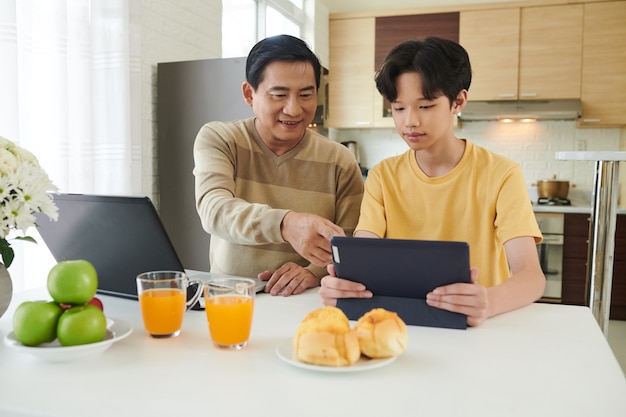 Father and Son Working at Home