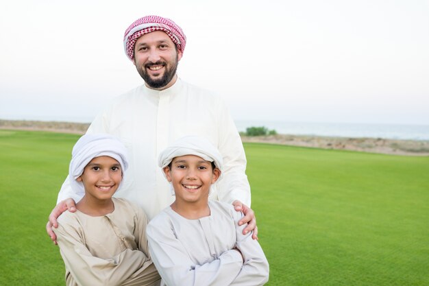 Father and sons in beautiful nature