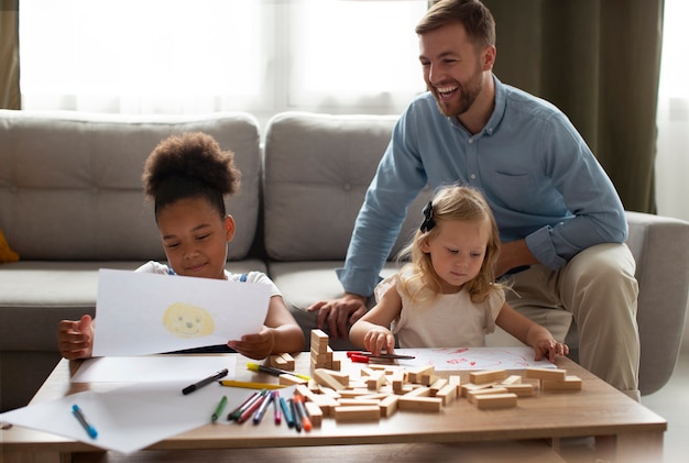 Photo father spending time with his adopted daughters