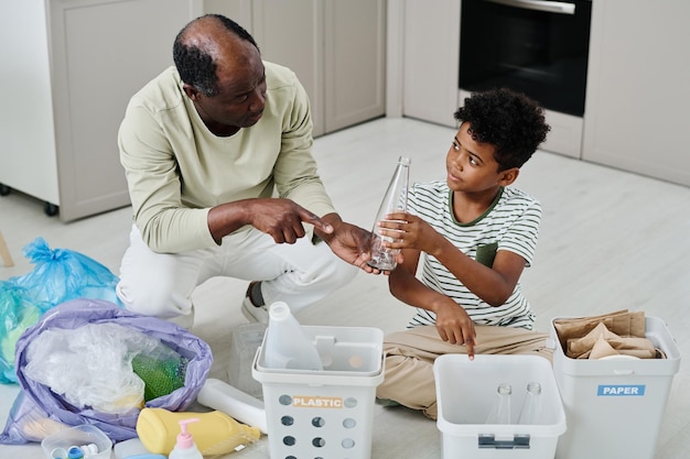 Father teaching son to separate the rubbish