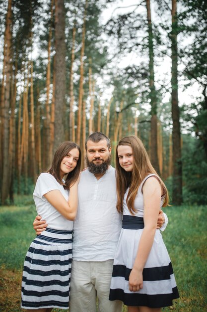 Father and two beautiful teenage daughter