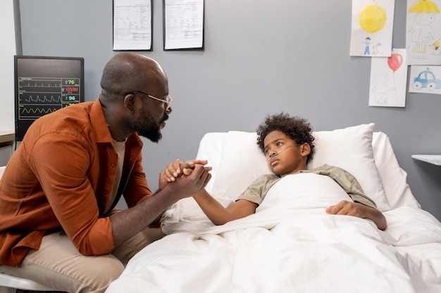 Father visiting his little son at hospital