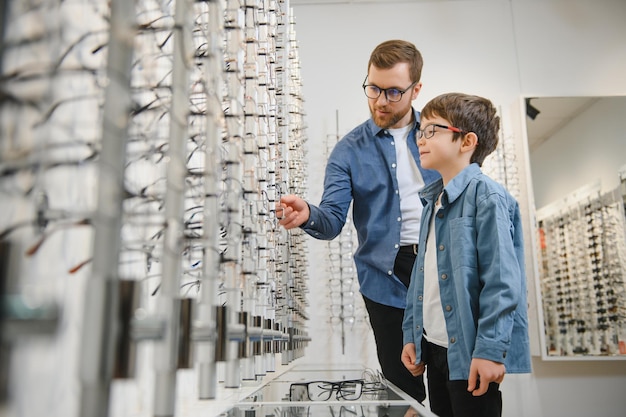 Father with cute son Family buy glasses