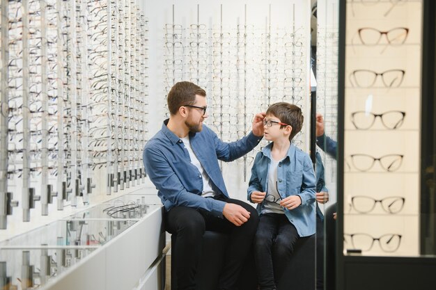 Father with cute son Family buy glasses