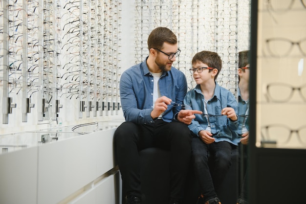 Father with cute son Family buy glasses