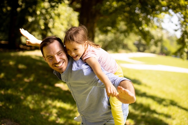 Father with daughter having fun at the park