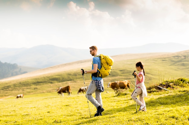 Father with daughter hiking