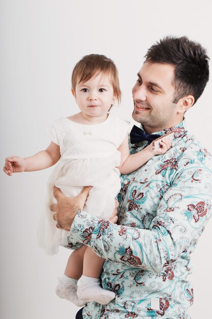 Father  with his daughter on a white background