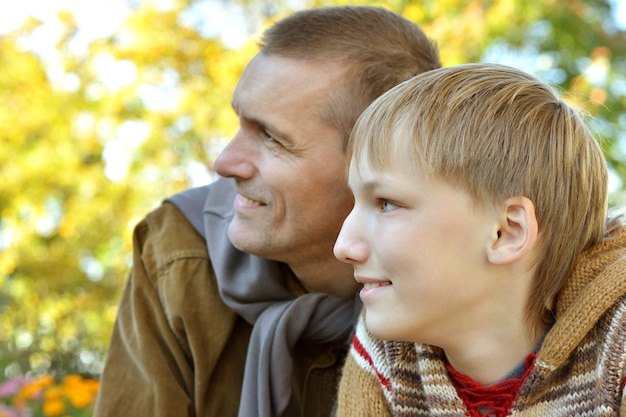 Father with his son have a walk in park