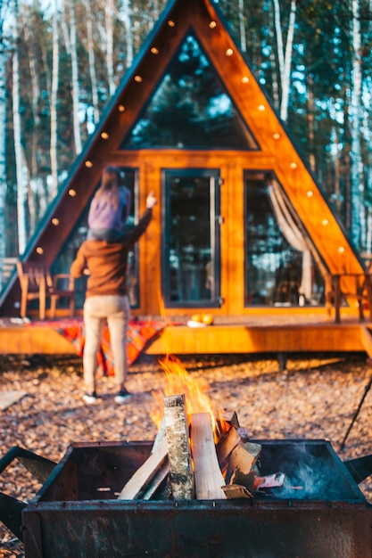 Father with kid at autumn day with close up of fire on the brazier