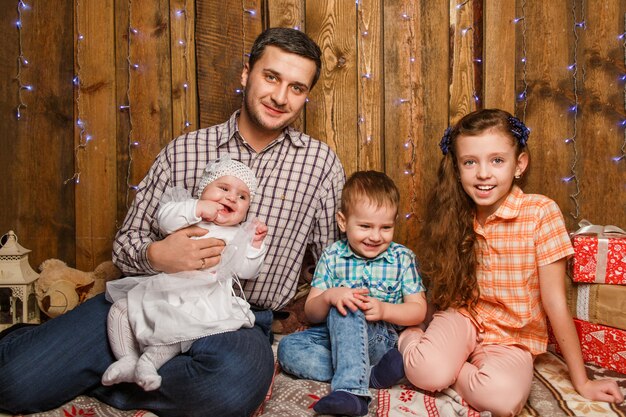 Father with kids in a Christmas photo session