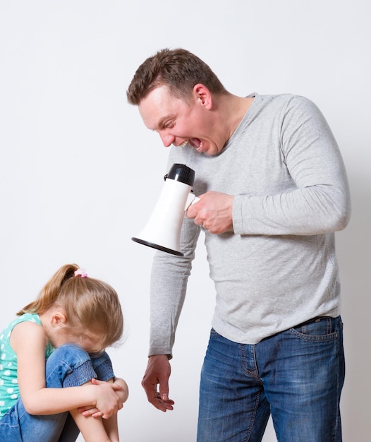 Father with megaphone screaming at daughter