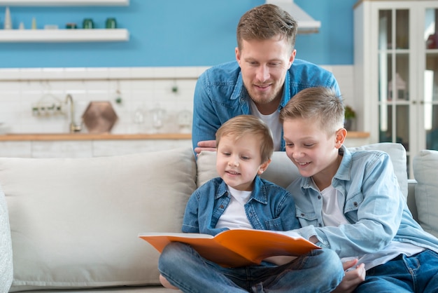 Father with siblings staying indoors