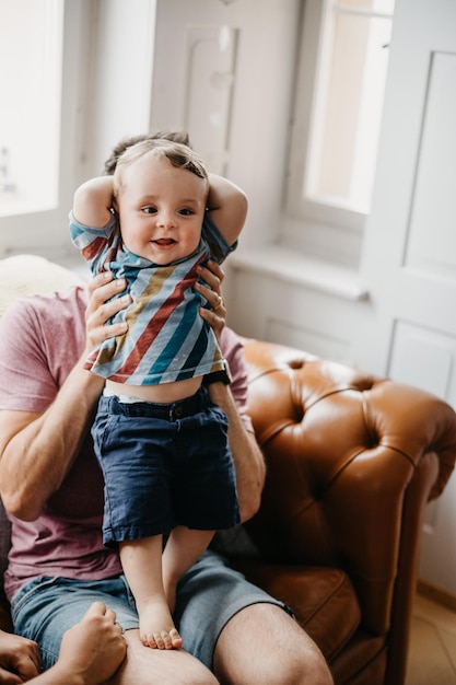 father with son on sofa at home