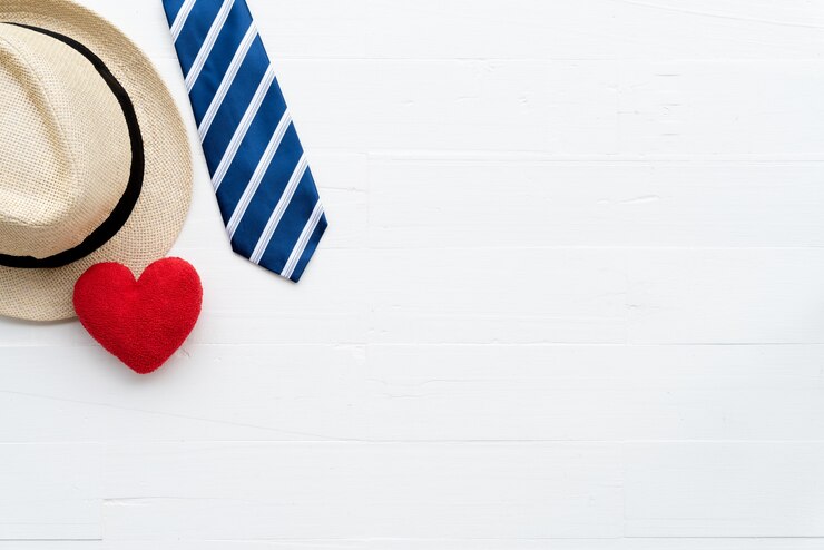Fathers day accessories on bright white pastel wooden table background.