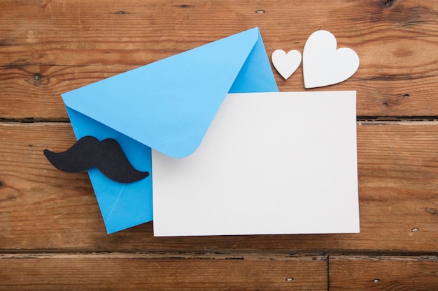 Fathers day blank card and envelope with mustache and love hearts