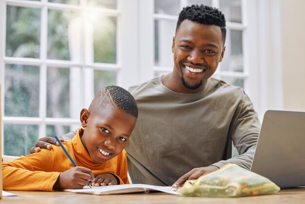 A fathers guidance will take you far Shot of a young father helping his son with homework at home