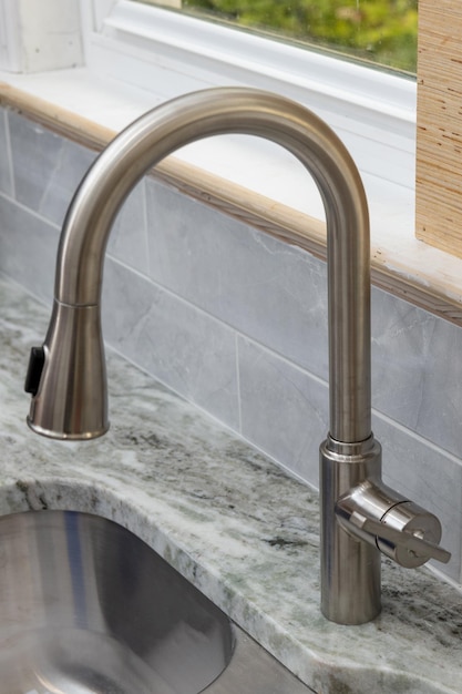 Faucet installed in the kitchen sunk crane modern silver