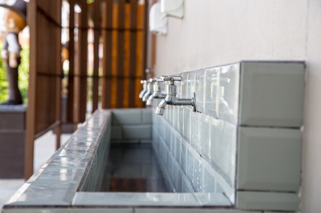 faucet and the long sink at toilet