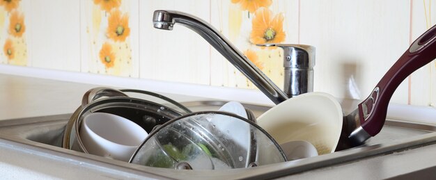 Photo faucet over utensils in sink