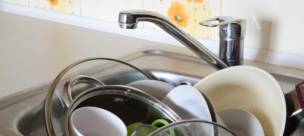 Photo faucet over utensils in sink