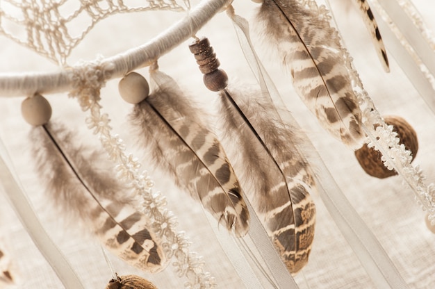 Photo feathers, pearls, pink beads