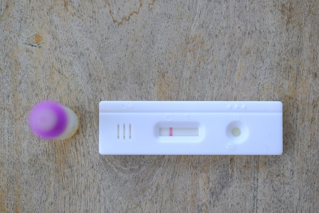 Fecal Test Kits on wooden floor.