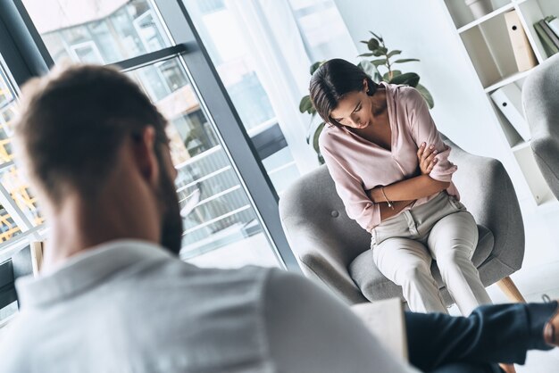 Feeling despair. Young frustrated woman solving her mental problems 