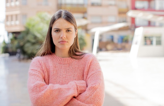 Feeling displeased and disappointed looking serious annoyed and angry with crossed arms