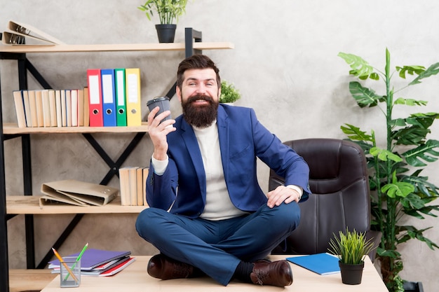 Feeling free Self care Relaxation techniques Mental wellbeing and relax Man bearded manager formal suit sit lotus pose relaxing Prevent professional burnout Way to relax Meditation yoga