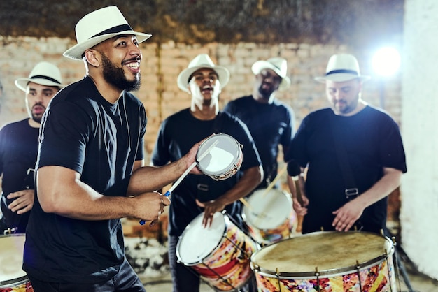 Feeling the rhythm in the drums Shot of a group of musical performers playing together indoors