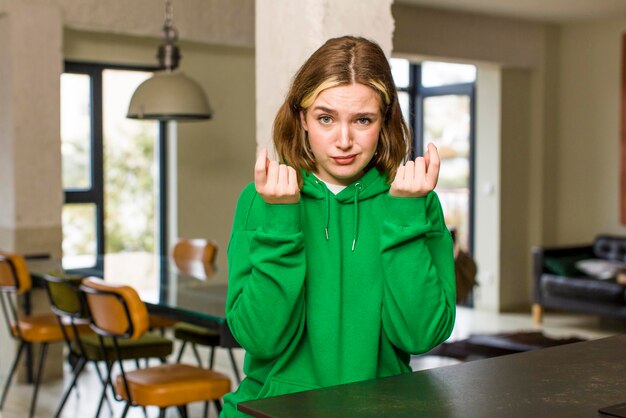 feeling sad and stressed no money gesture with a negative and anxious look