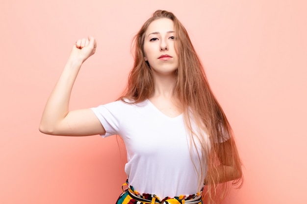 feeling serious, strong and rebellious, raising fist up, protesting or fighting for revolution