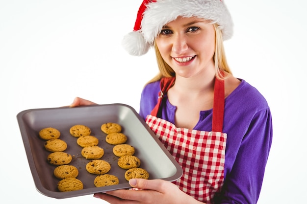 Feestelijk blonde die hete koekjes tonen