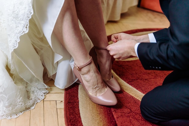 Feet of bride and groom wedding shoes
