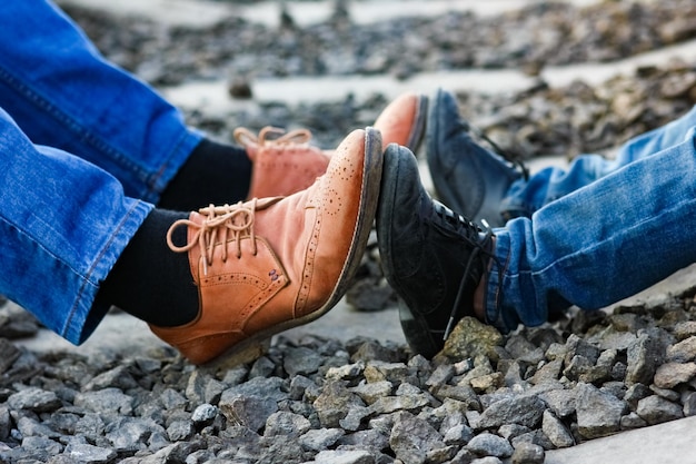 Feet father and son cowboy shoes