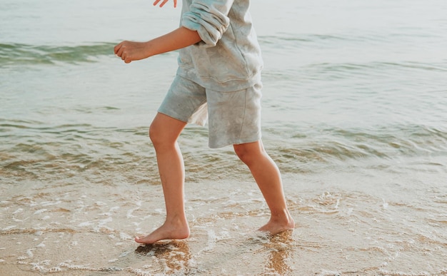 feet run along the sandy beach