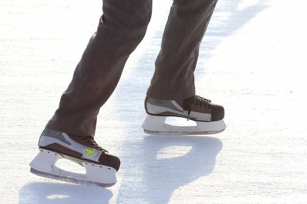 Feet skating on the ice rink