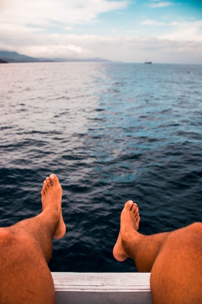 Feet at the stern of the ship