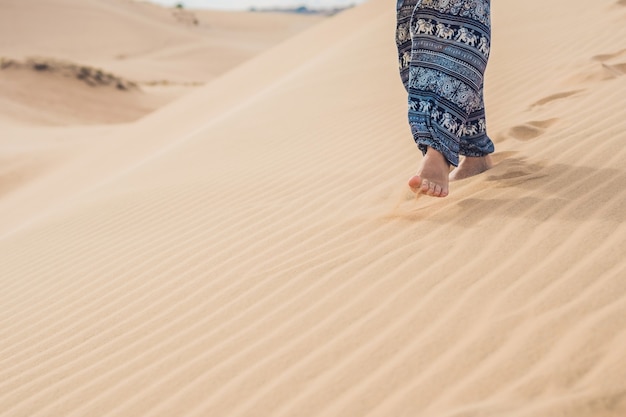 Feet of a woman in the desert