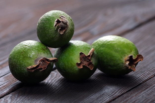 feijoa fruits on a wooden table close up