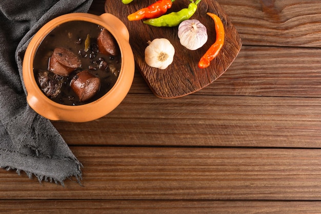 Feijoada typical Brazilian food. Traditional Brazilian food made with black beans. Top view. copy space.