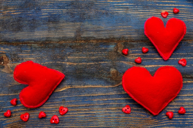 Felt hearts on wooden table