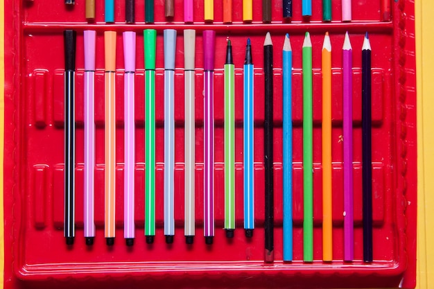 Felttip pens in a box Colored pencils background and texture