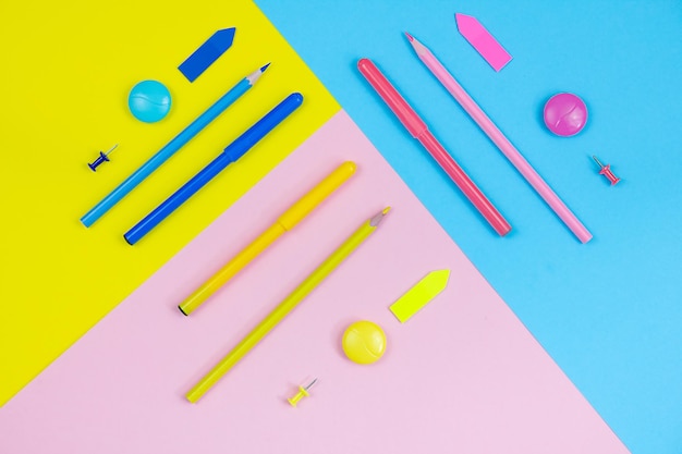 Felttip pens pencils and other stationery on pastel backgrounds Back to school concept.