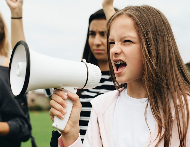 Female activist shouting on a megaphone