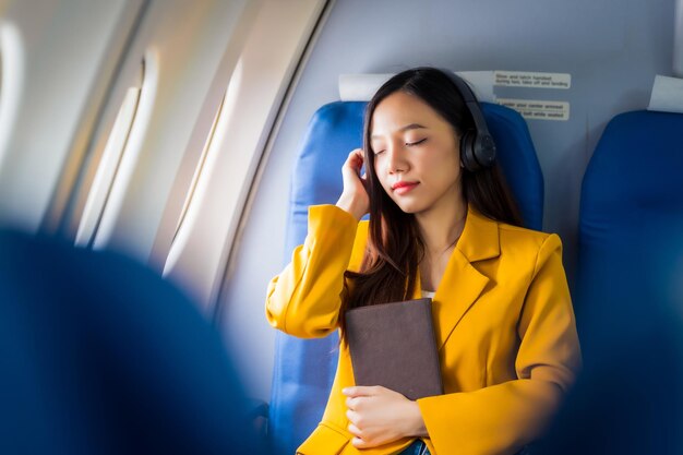 Female airplane passengers asian chinese people entrepreneurs on flight venturing overseas