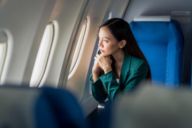 Photo female airplane passengers asian chinese people entrepreneurs on flight venturing overseas