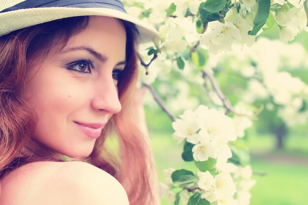 Photo female in apple tree flower