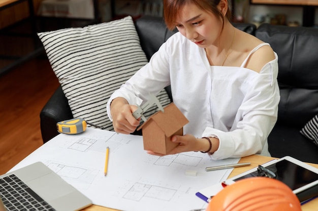 Female architect working in office